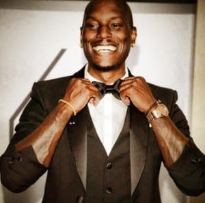 Tyrese Gibson smiling in a tuxedo