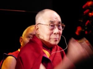 The Dalai Lama waves to the crowd. 