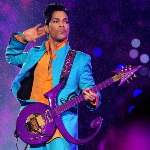 Prince with purple symbol guitar